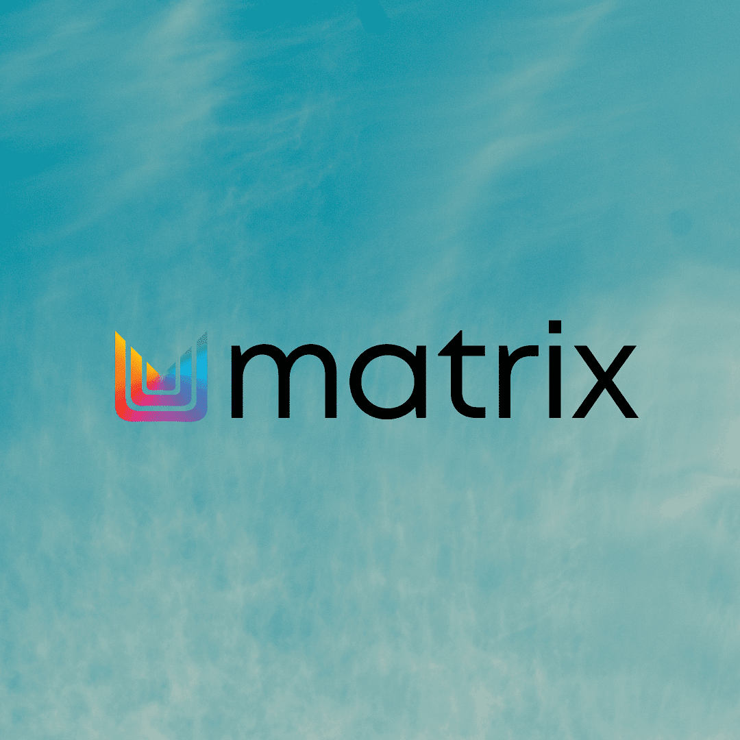 Colorful "matrix" logo on a sky background with light clouds.